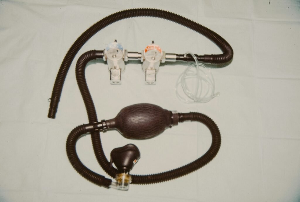Medical device with tubes and bulb on white background